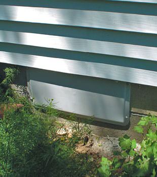 A gray crawl space vent cover in Sharbot Lake