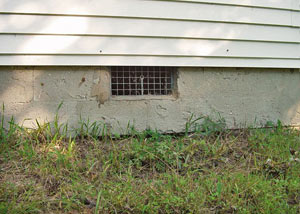 Open crawl space vents that let rodents, termites, and other pests in a home in Bruceton