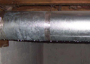 condensation collecting on an HVAC vent in a humid Griffith basement