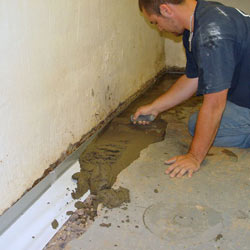 Testing a French drain system in a Trent River home.