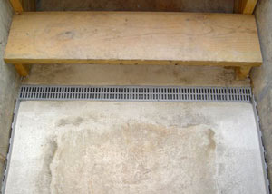 Our grated drain system installed on a leaking basement staircase in Frankford.