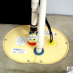 A sump pump system installed along a basement floor in Belleville.