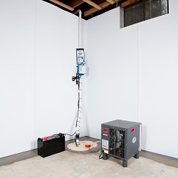 Sump pump system, dehumidifier, and basement wall panels installed during a sump pump installation in Matawatchan