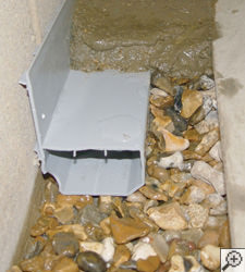 A no-clog basement french drain system installed in Bancroft