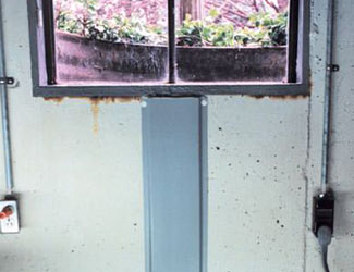 Repaired waterproofed basement window leak in Tweed