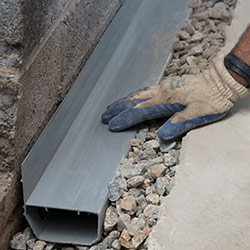 installing a drain tile system in a Kaladar home